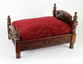 Appraisal: Carved mahogany doll bed Carved mahogany doll bed h x