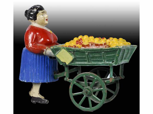 Appraisal: French Martin Fruit Cart Vendor Toy Description Wind-up Working Tin