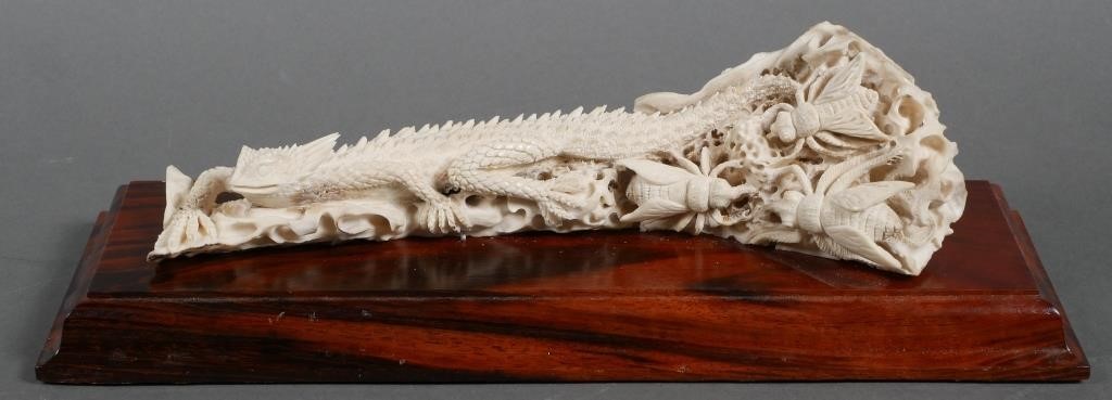 Appraisal: CARVED BONE BEARDED DRAGON SCULPTURENicely handcarved bone statue of a