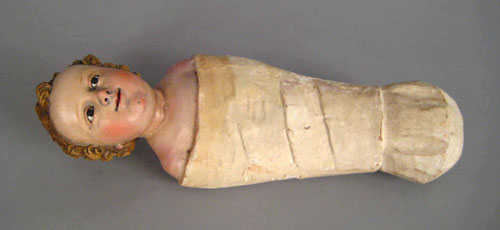 Appraisal: Carved and painted figure of a swaddled infant th c