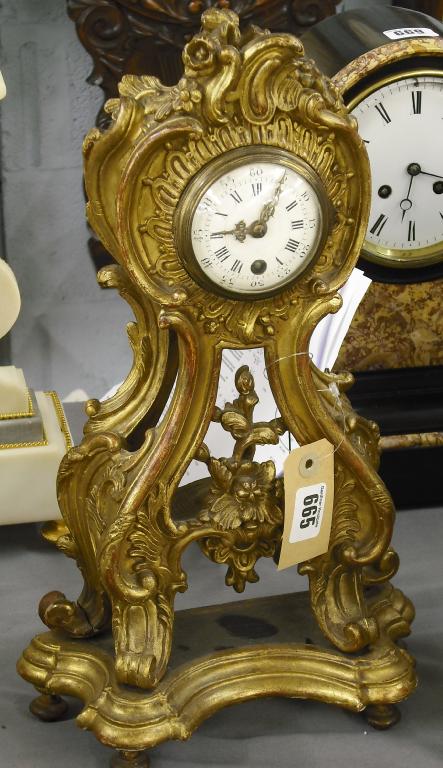 Appraisal: French gilded wooden mantel timepiece the movement with silk suspension