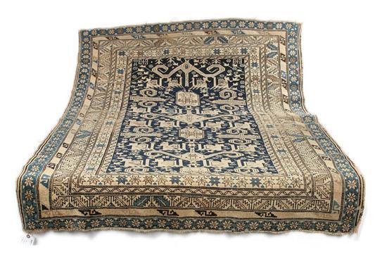 Appraisal: ORIENTAL RUG Geometric figural design with multiple borders Blue and