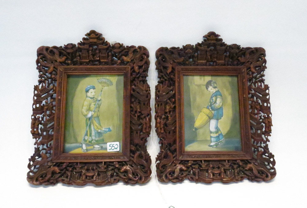 Appraisal: TWO CHINESE CARVED WOOD PICTURE FRAMES with reticulated carvings depicting