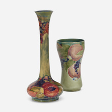 Appraisal: Moorcroft Pottery Early Pomegranate chalice and vase set of two