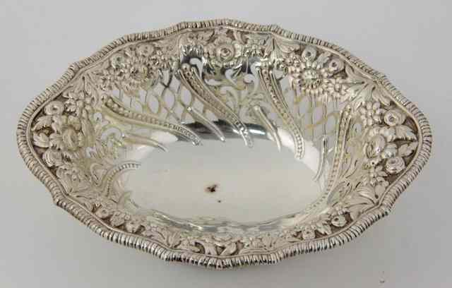 Appraisal: A silver oval bon-bon dish London with embossed floral and