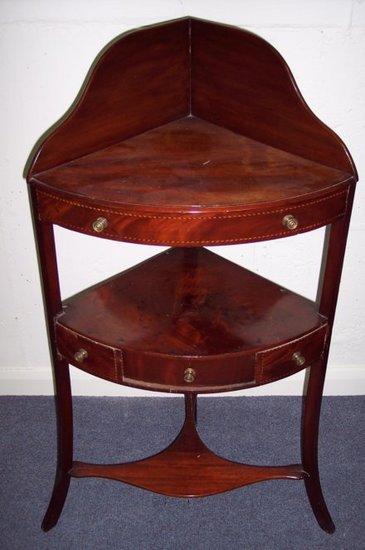 Appraisal: A George III mahogany three-tier corner washstand with gallery back