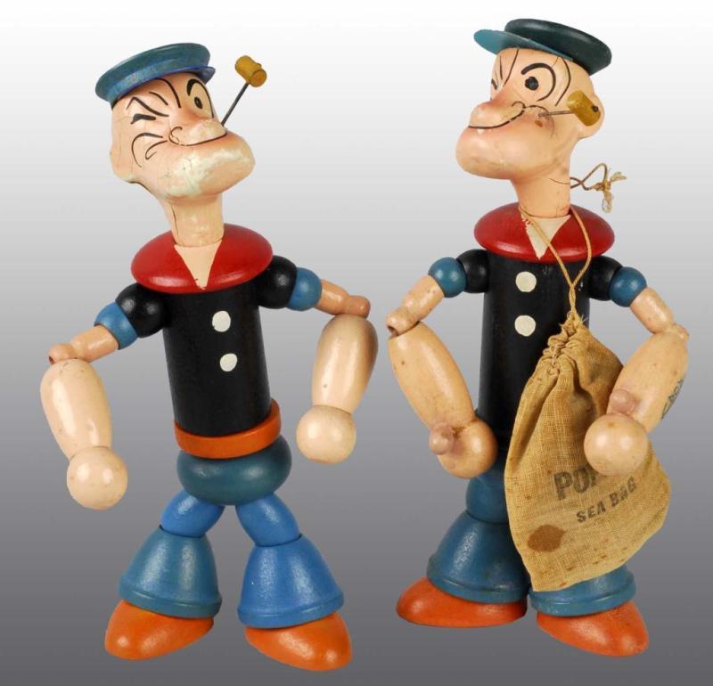 Appraisal: Pair of Chein Popeye Dolls Description Both are wood jointed