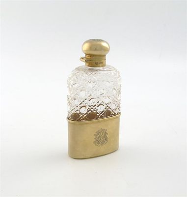 Appraisal: An Edwardian silver gilt and cut glass spirit flask by