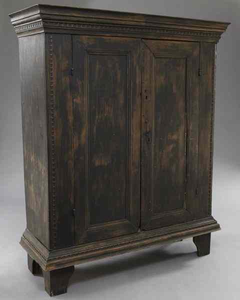 Appraisal: American primitive pine armoire with a stepped cornice over two