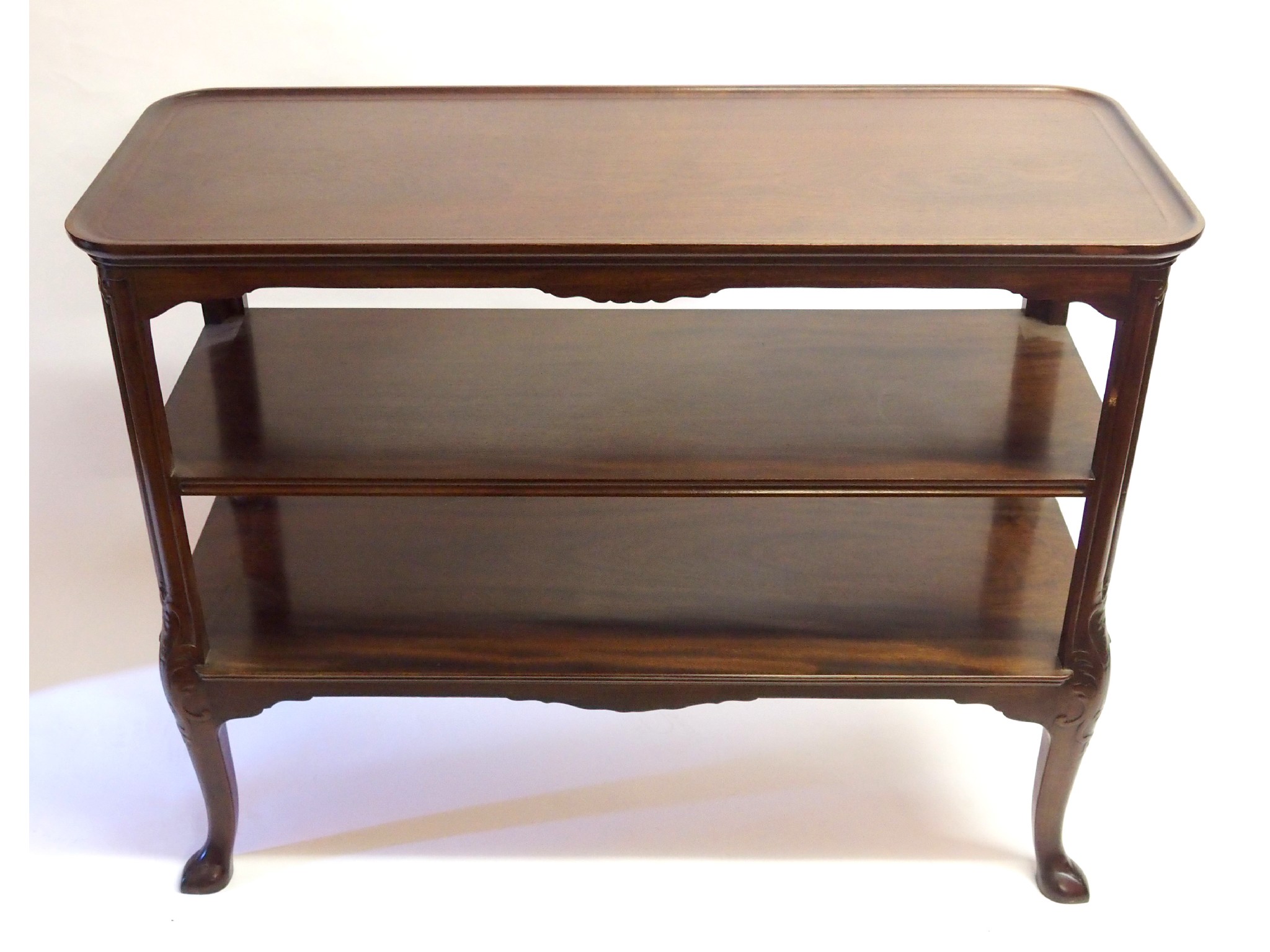 Appraisal: A Whytock Reid mahogany three tier buffetwith foliate carved legs