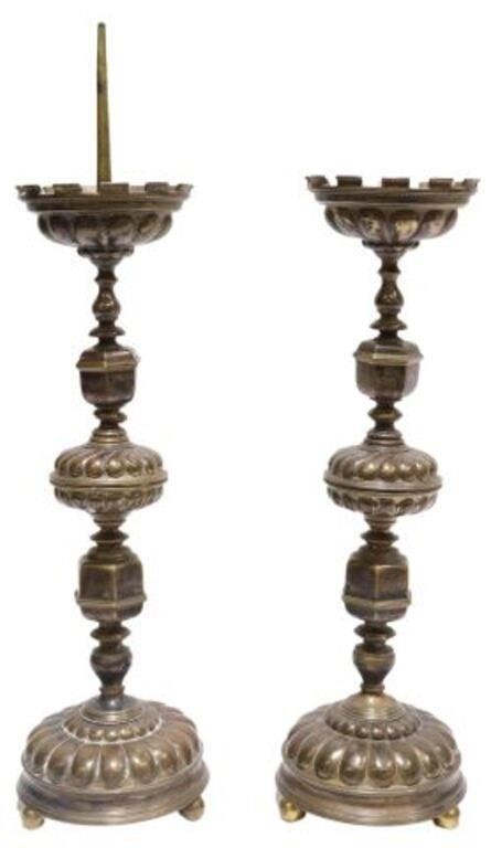 Appraisal: pair Continental patinated metal altar candlesticks having turned-form standard with