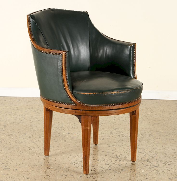 Appraisal: FRENCH LEATHER SWIVEL BERGERE CHAIR WALNUT FRAME A French leather