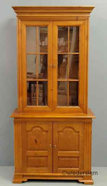 Appraisal: Chippendale style pine two-piece cabinet with two six-light doors shelved