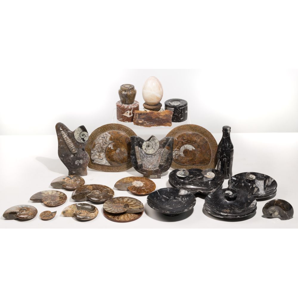 Appraisal: CARVED FOSSIL ASSORTMENTApproximately Moroccan ammonite fossils and fossil clusters having