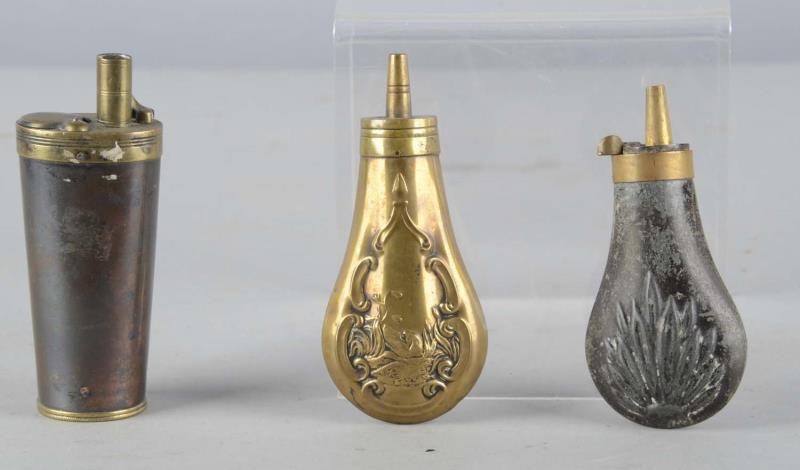 Appraisal: Lot of Decorative Gunpowder Flasks Three metal gunpowder flasks Condition