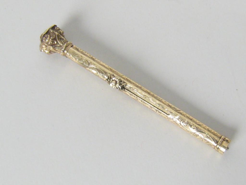 Appraisal: A gilt metal retractable nib Pen and Propelling Pencil with