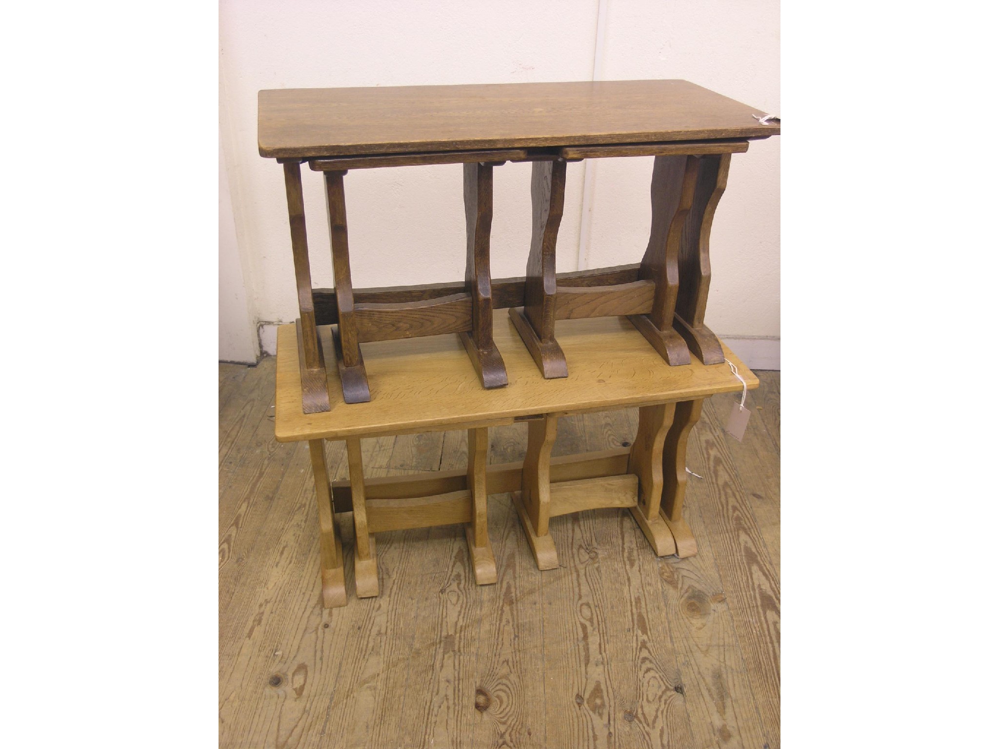 Appraisal: A solid light oak nest of three tables ft in