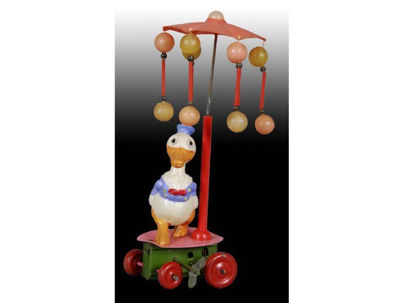 Appraisal: Walt Disney Celluloid Small Donald Duck Carousel T Description -