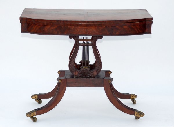 Appraisal: Classical card table Banded top Carved lyre base Splay legs