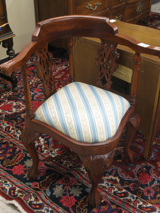 Appraisal: CHIPPENDALE STYLE MAHOGANY CORNER ARMCHAIR with drop-in cushion seat over