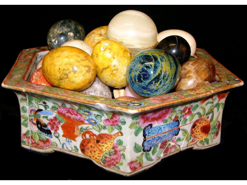 Appraisal: Collection of hardstone eggs within a Chinese Canton hexagonal famille