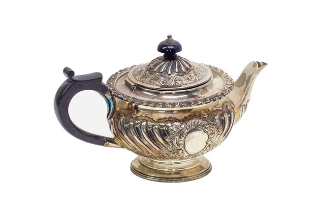 Appraisal: A late Victorian silver teapot of squat circular form with