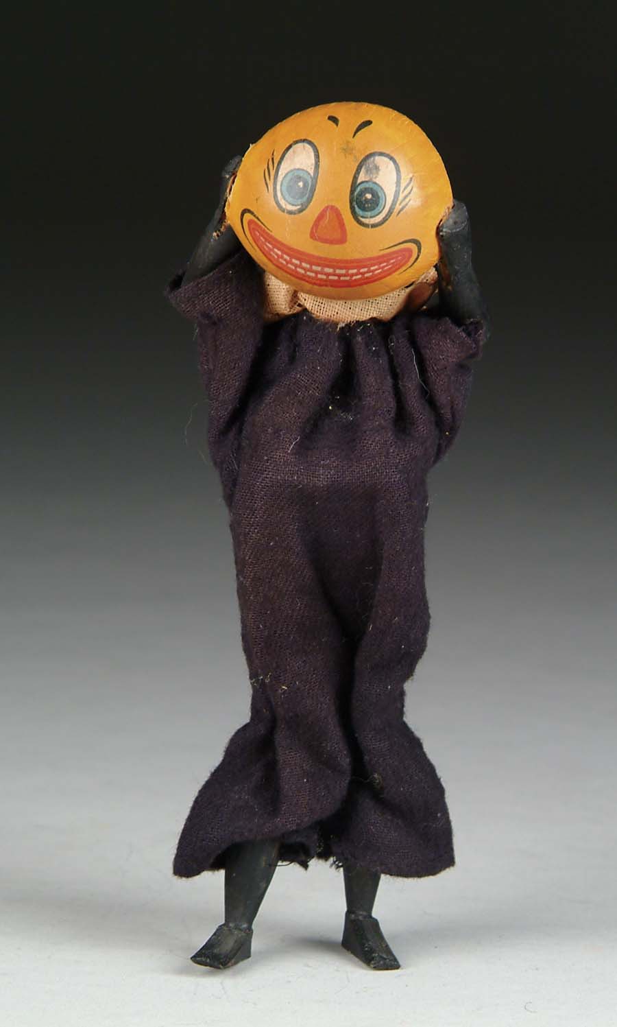 Appraisal: MECHANICAL CAT WITH PUMPKIN MASK Mechanical toy shows cloth-dressed figure