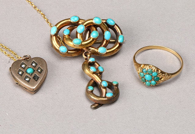 Appraisal: A TURQUOISE SET BROOCH scrolled panel set with oval turquoise