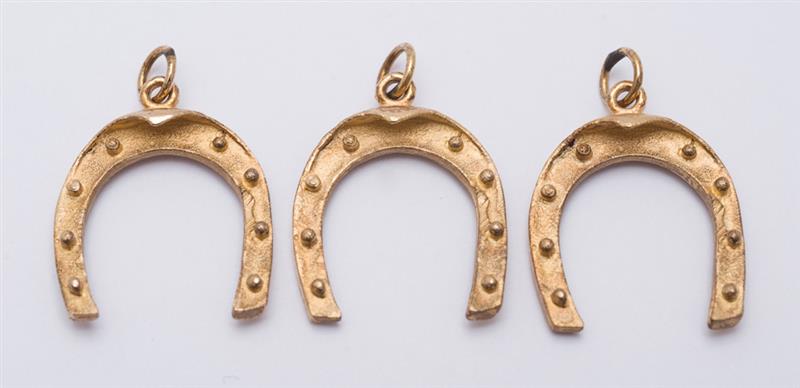 Appraisal: THREE K GOLD HORSESHOE PENDANTS x in each approx grams