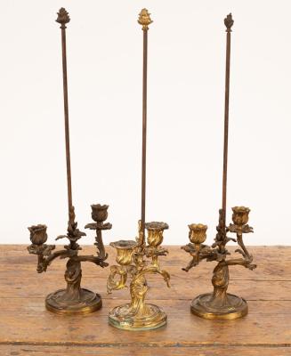 Appraisal: A pair of Louis XV gilt-bronze twin-branch candelabra the leaf