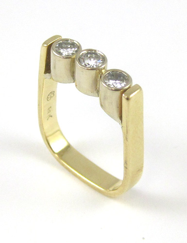 Appraisal: DIAMOND AND FOURTEEN KARA GOLD RING set with three round-cut