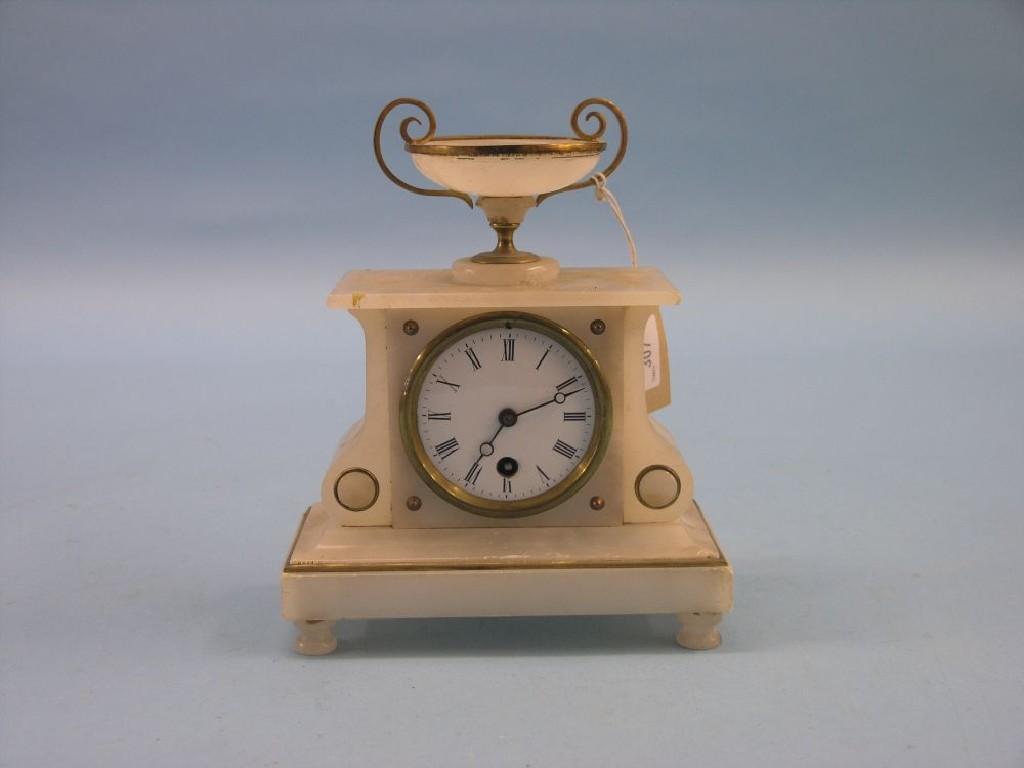 Appraisal: An alabaster mantel clock with silvered dial and timepiece movement