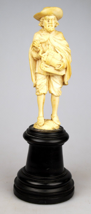 Appraisal: A Dieppe carved ivory figure of a hurdy-gurdy player in