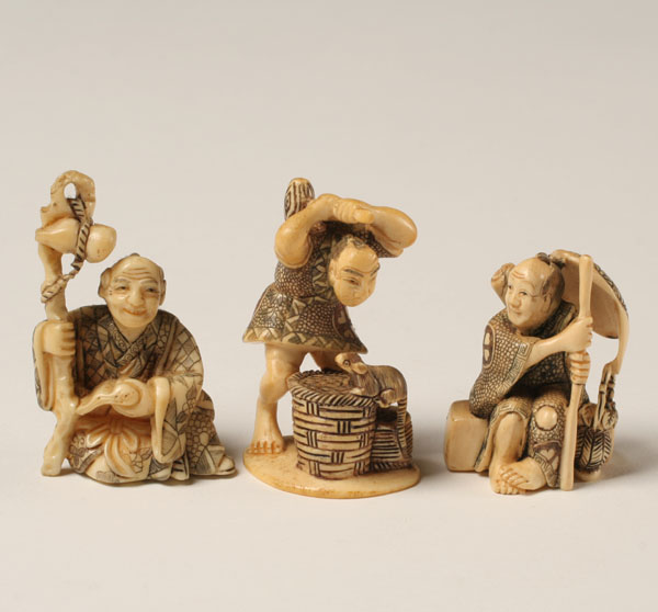 Appraisal: Japanese carved ivory netsukes workers Tallest The elephant ivory used