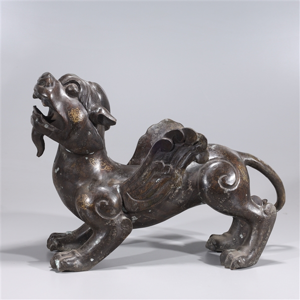 Appraisal: Chinese bronze statue of a winged lion with gilt detail