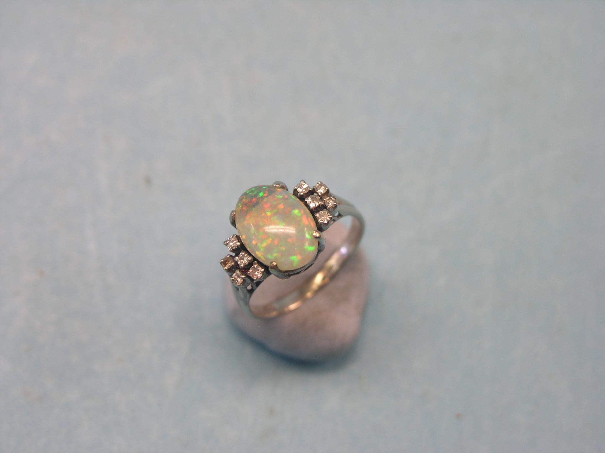 Appraisal: An ct white gold opal and diamond chip ring large