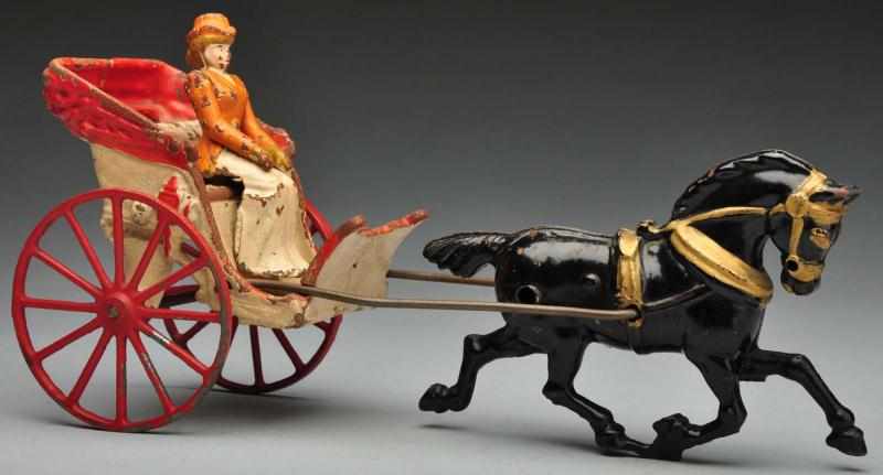 Appraisal: Cast Iron Hubley Gig Horse-Drawn Toy Description American Original woman