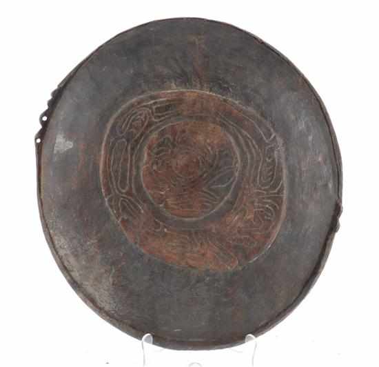 Appraisal: STONECUT BOIKEN CARVED BOWL stylised design to anterior pierced lugs