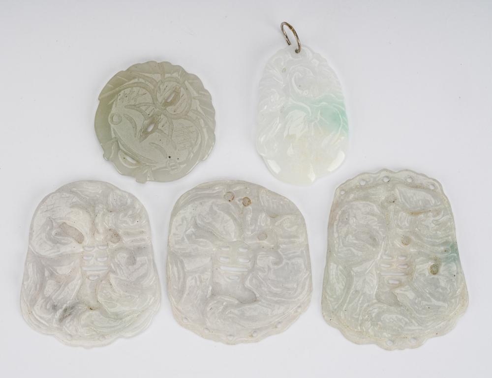 Appraisal: FIVE WHITE JADE PENDANTScarved and pierced of various designs smallest