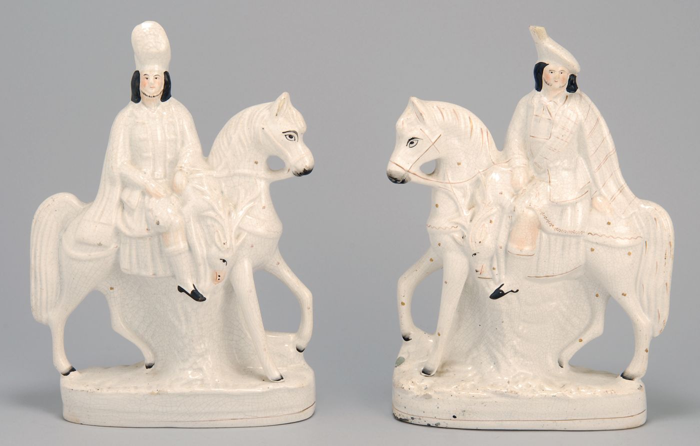 Appraisal: PAIR OF ANTIQUE STAFFORDSHIRE FIGURES th CenturyMen on horses Height