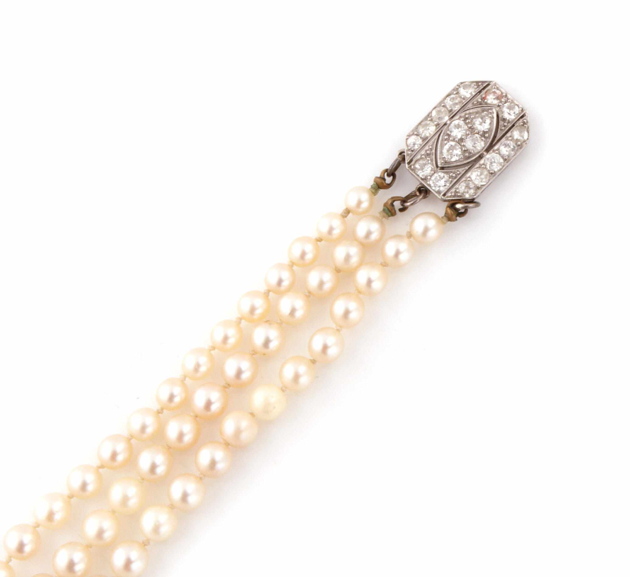 Appraisal: A cultured pearl triple strand necklace with an art deco