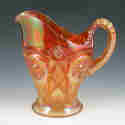 Appraisal: Carnival glass handled pitcher with cut-like design Unmarked Minute nick