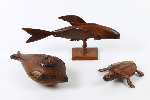 Appraisal: A GROUP OF THREE PITCAIRN ISLANDS WOODEN CARVINGS including a