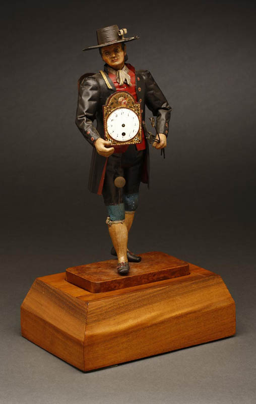 Appraisal: Austrian or German painted figural peddler clock Austrian or German