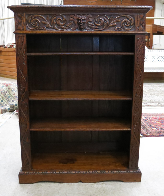 Appraisal: CARVED OAK BOOKCASE English late th century having three adjustable