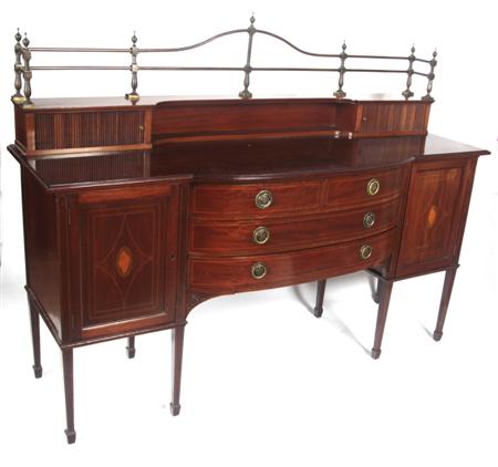 Appraisal: An Edwardian mahogany breakfront sideboard In the Regency style the