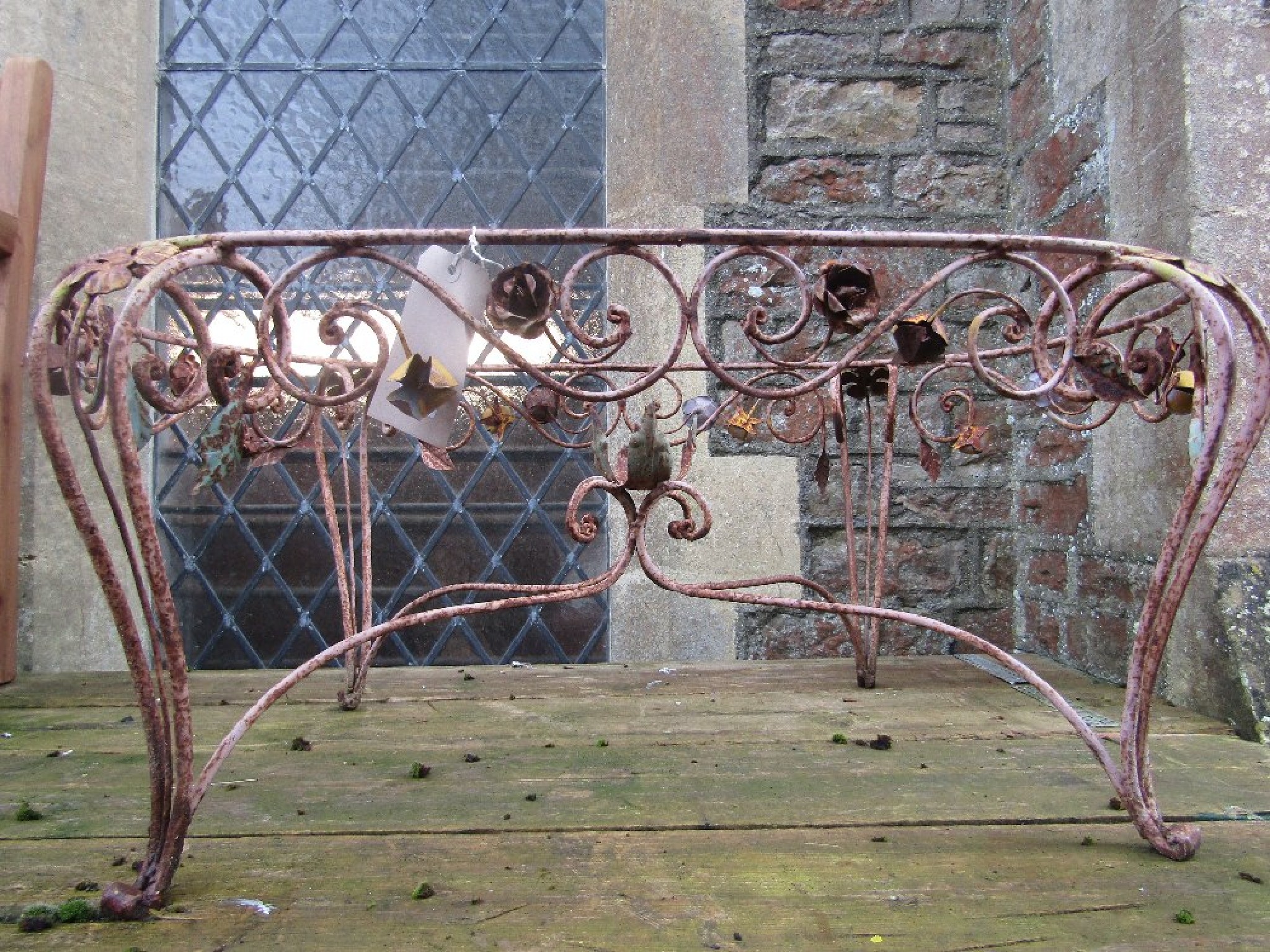 Appraisal: A low ironwork garden table of oval form the open