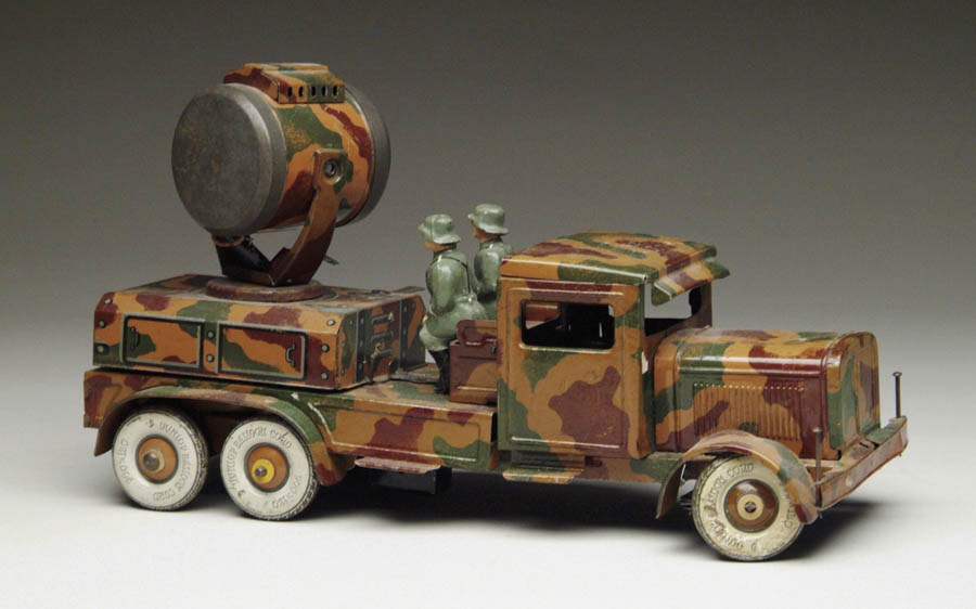 Appraisal: TIPP CO SPOTLIGHT TRUCK W GERMAN SOLDIERS Large camouflage clockwork