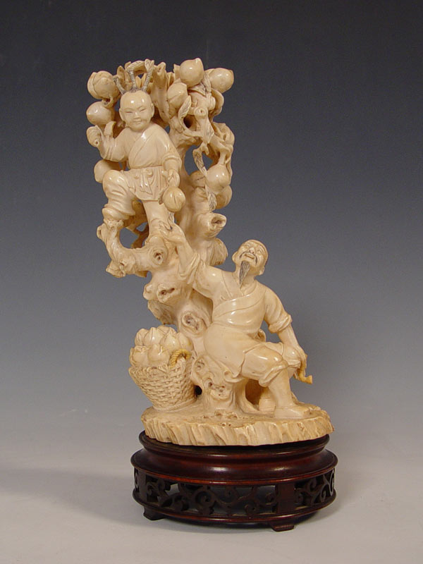 Appraisal: CHINESE LARGE CARVED IVORY FIGURAL GROUP Man and young boy