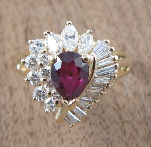 Appraisal: RUBY DIAMOND AND FOURTEEN KARAT GOLD RING round-cut and baguette-cut